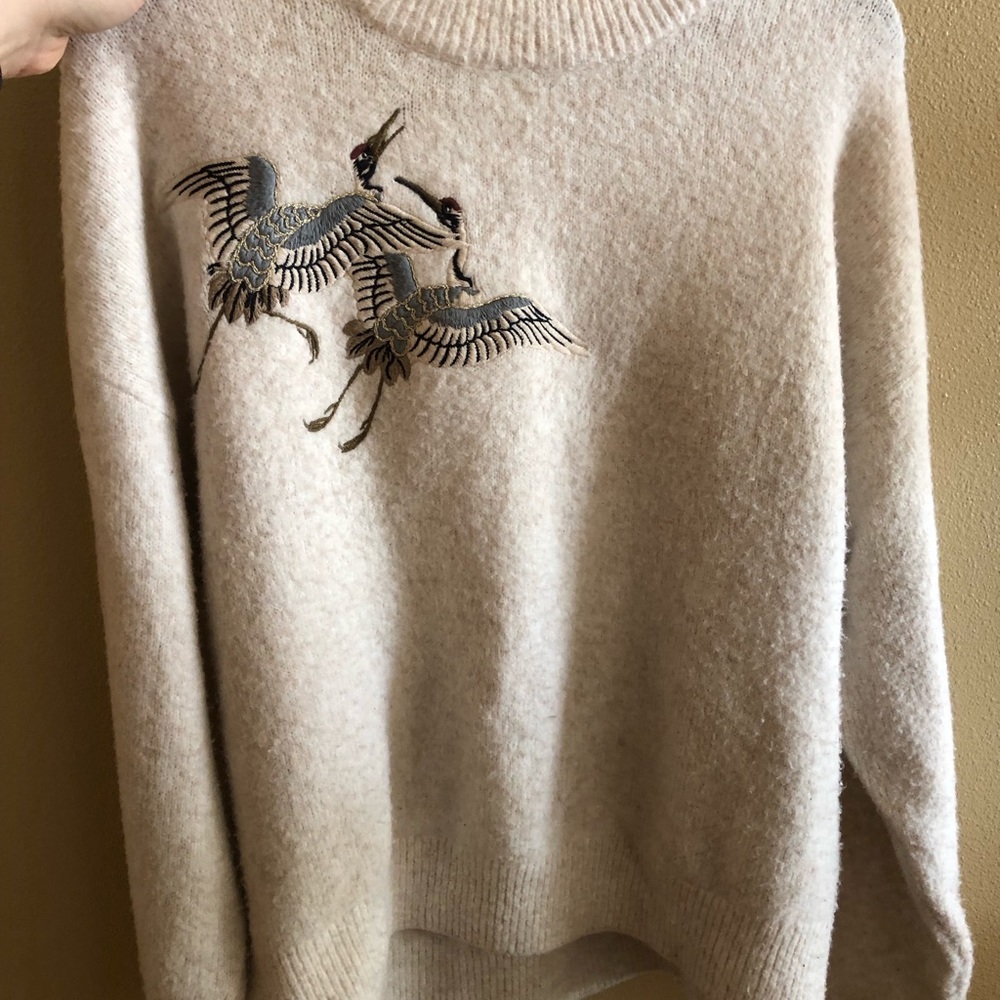 Cream sweater with embroidered cranes